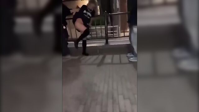 Japanese whore is stripped naked by a customer on the street