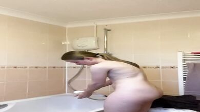 Rebecca Squires with glasses in the shower