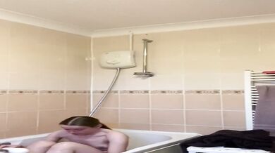 Rebecca Squires with glasses in the shower