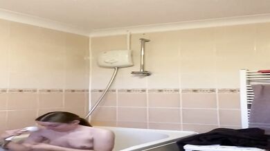 Rebecca Squires with glasses in the shower