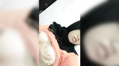 Busty Arab slut plays with her titties