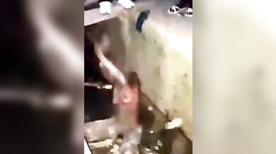 African naked witch wallowed in gutter