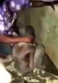 African naked witch wallowed in gutter