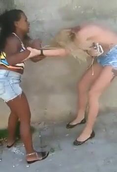 Black girl beats white topless blondie probably in Brazil