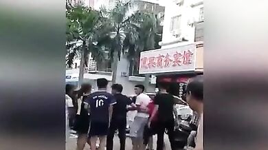 Chinese wife and her gang tries to strip mistress in street