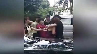 Chinese wife and her gang tries to strip mistress in street