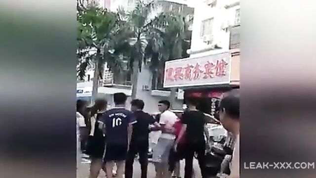 Chinese wife and her gang tries to strip mistress in street - 2 image