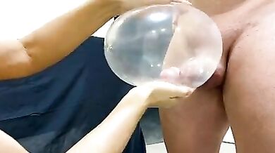 Mom is jerking son's dick with a condom