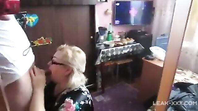 Son bought a camera and made his old mother suck his dick - 1 image